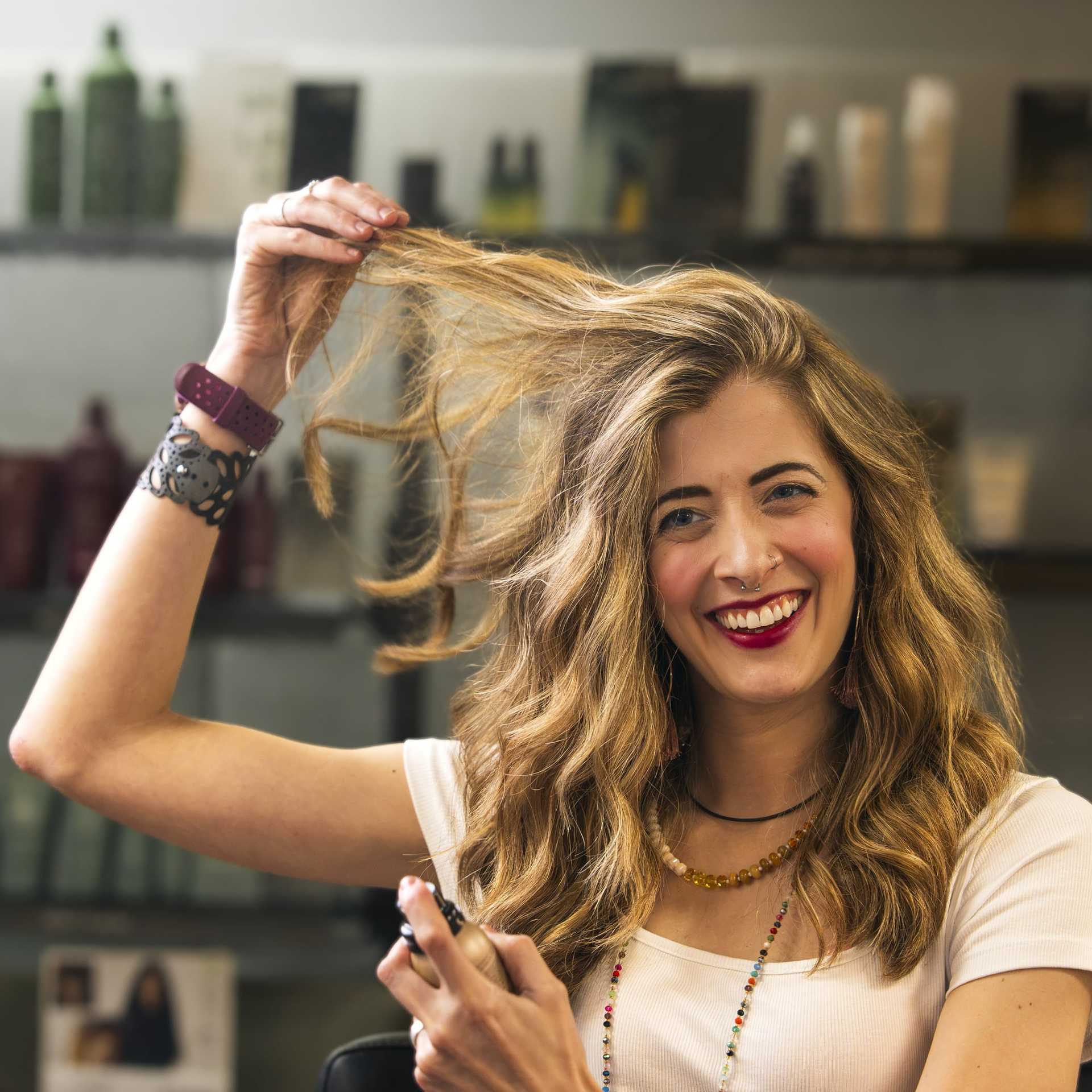 Portrait of Sidney Stotsky, a professional stylist at Salon Enso, showcasing their expertise and style.