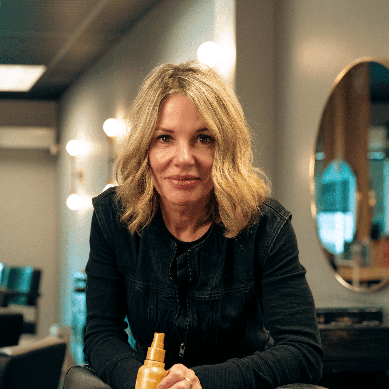 Portrait of Kelly Wimer, a professional stylist at Salon Enso, showcasing their expertise and style.