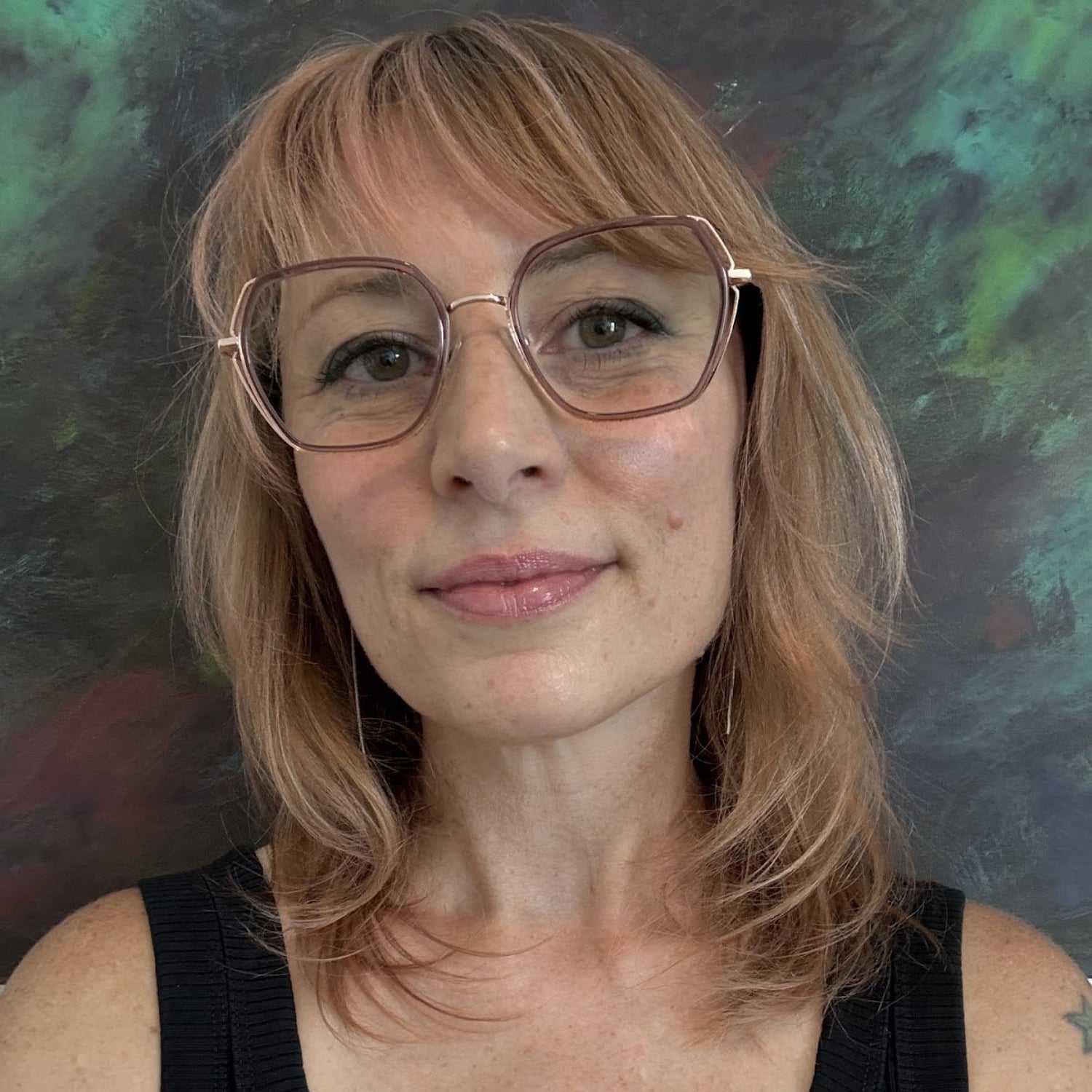 Portrait of Jennifer, a professional stylist at Salon Enso, showcasing their expertise and style.