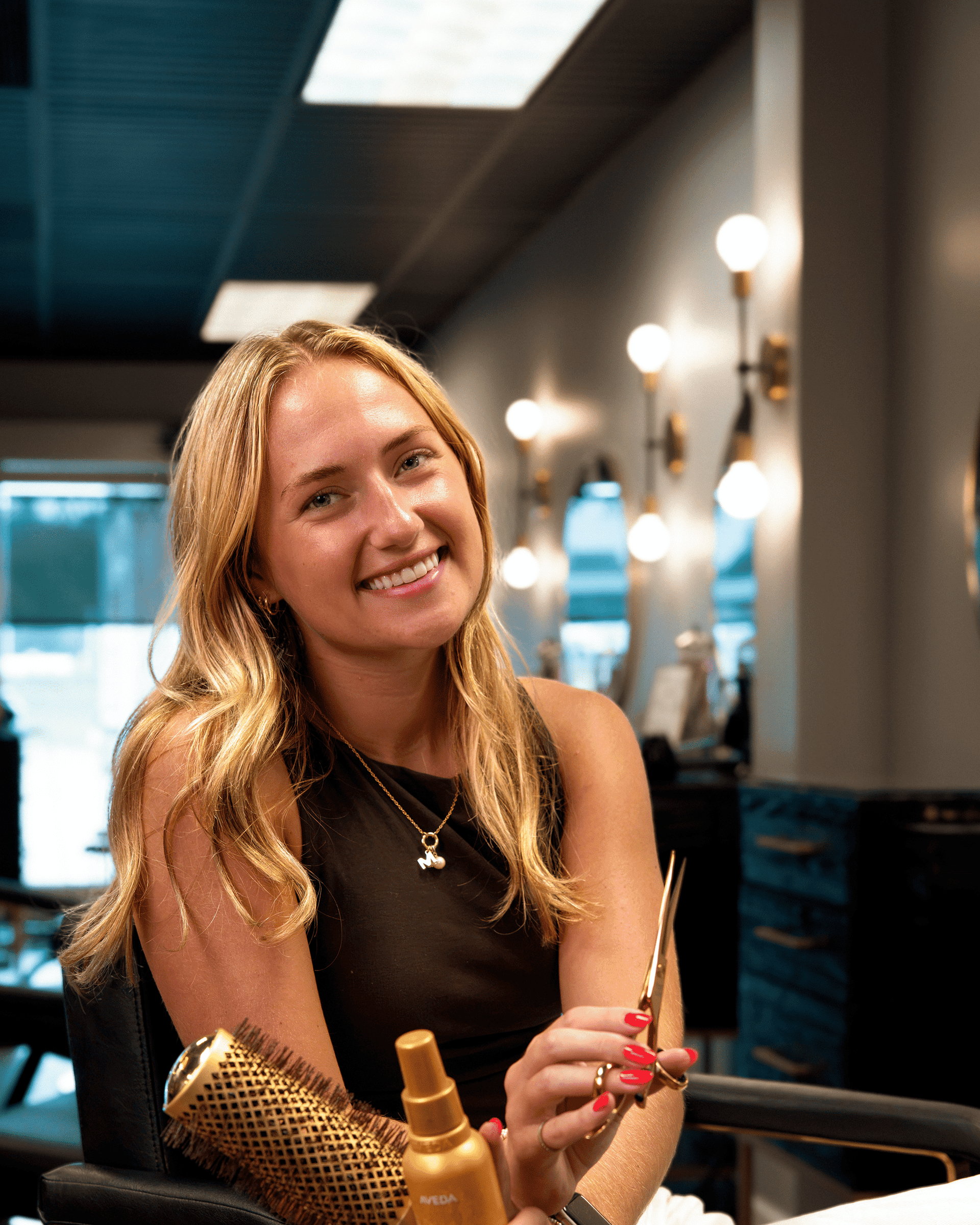 Portrait of Hailey Nelson, a professional stylist at Salon Enso, showcasing their expertise and style.