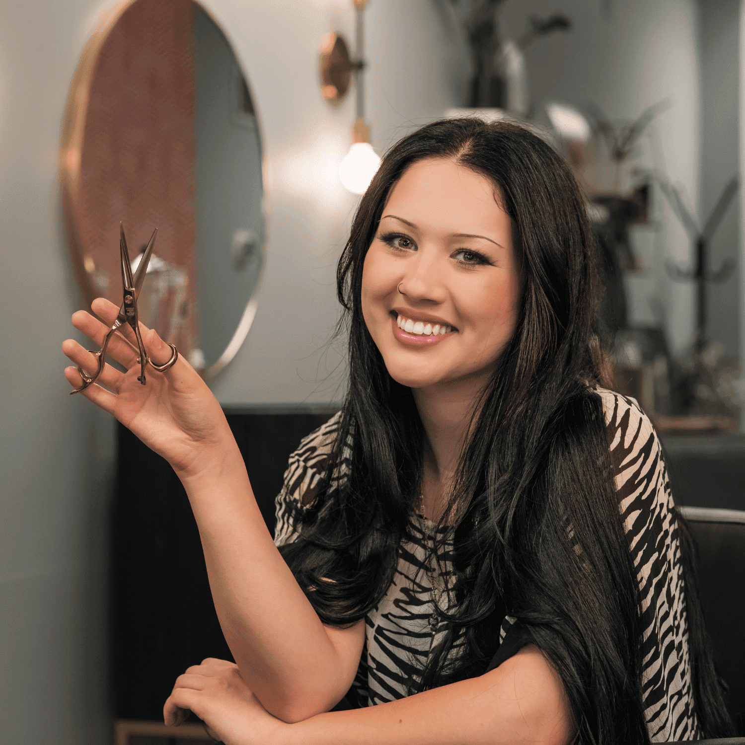 Portrait of Elizabeth Kreider, a professional stylist at Salon Enso, showcasing their expertise and style.